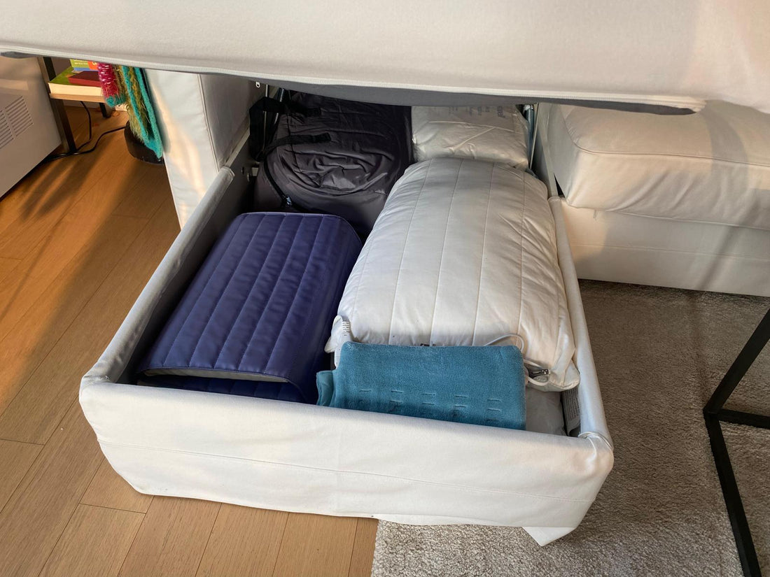 Nutshell cooler in the storage bin under a couch