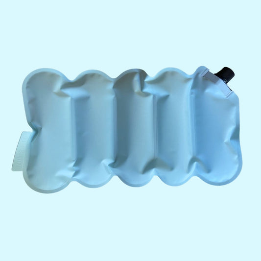 blue nutshell ice pack over solid teal background